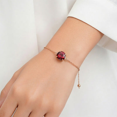 garnet birthstone bracelet in rose gold finish — model view