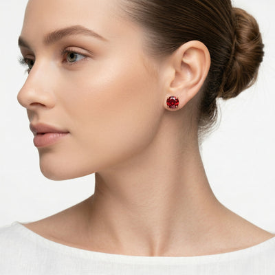 garnet birthstone stud earrings in rose gold finish — model view