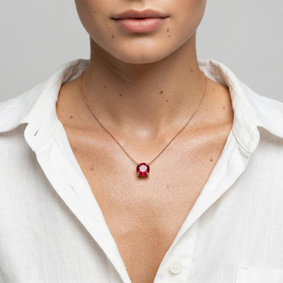 garnet birthstone necklace in rose gold finish — model view