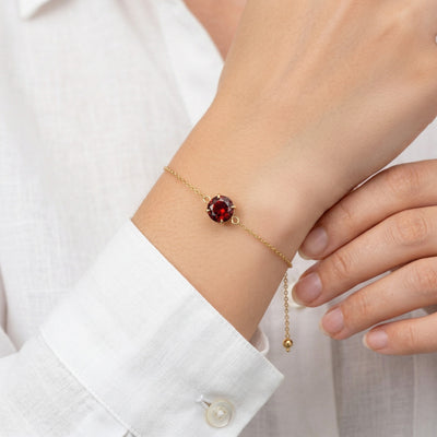 garnet birthstone bracelet in yellow gold finish — model view