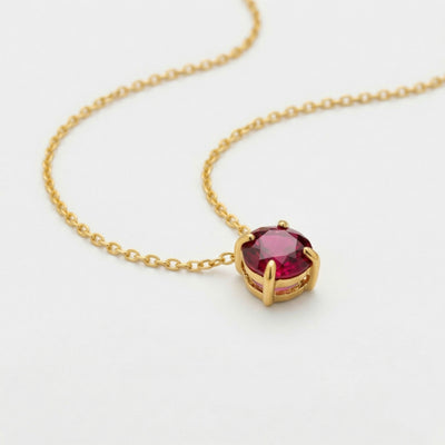 garnet birthstone necklace in yellow gold finish — side view