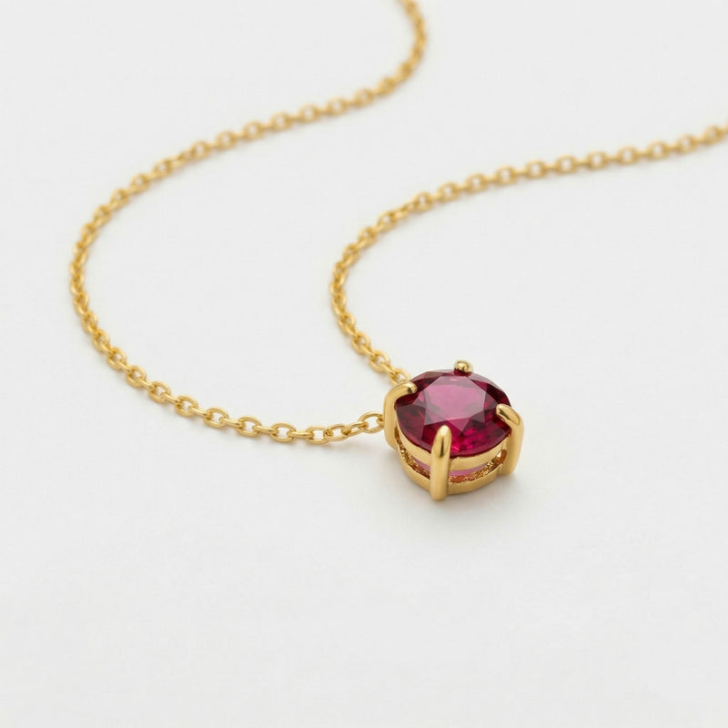 garnet birthstone necklace in yellow gold finish — side view