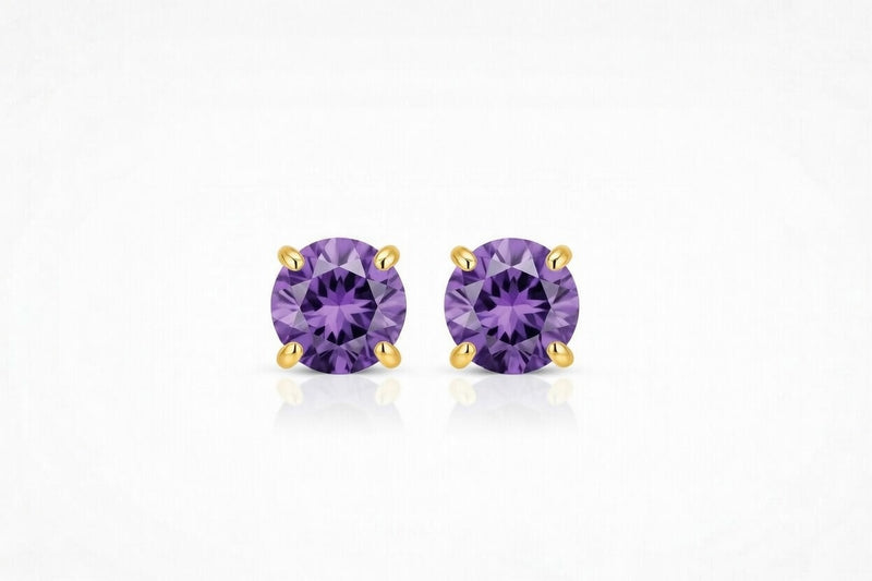 amethyst birthstone stud earrings in yellow gold finish — front view