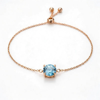 aquamarine birthstone bracelet in rose gold finish — front view