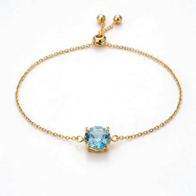 aquamarine birthstone bracelet in yellow gold finish — front view