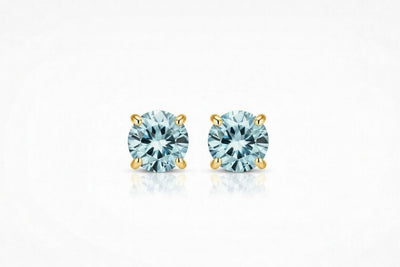 aquamarine birthstone stud earrings in yellow gold finish — front view
