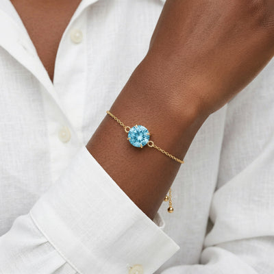 aquamarine birthstone bracelet in yellow gold finish — model view