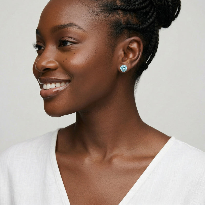 aquamarine birthstone stud earrings in yellow gold finish — model view
