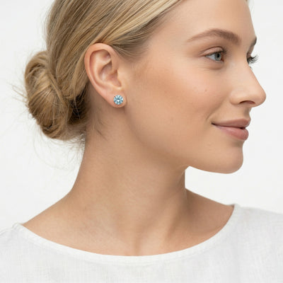 aquamarine birthstone stud earrings in rose gold finish — model view