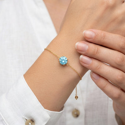 aquamarine birthstone bracelet in yellow gold finish — model view