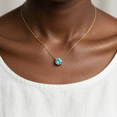 aquamarine birthstone necklace in yellow gold finish — model view