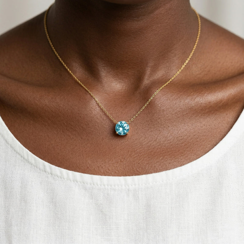 aquamarine birthstone necklace in yellow gold finish — model view