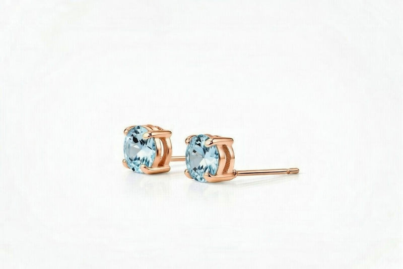 aquamarine birthstone stud earrings in rose gold finish — side view