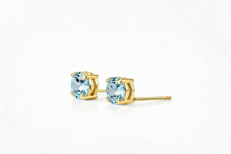 aquamarine birthstone stud earrings in yellow gold finish — side view