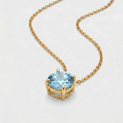 aquamarine birthstone necklace in yellow gold finish — side view