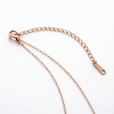 diamond birthstone necklace in rose gold finish — back view