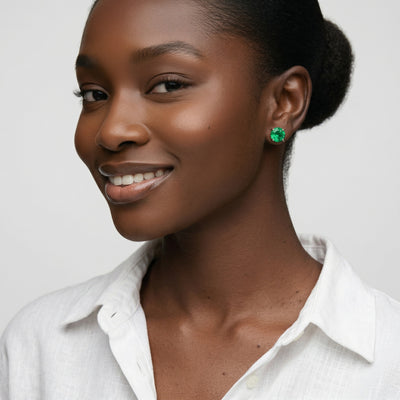 emerald birthstone stud earrings in white gold finish — model view
