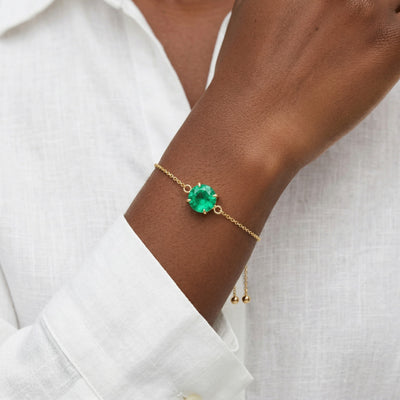 emerald birthstone bracelet in yellow gold finish — model view