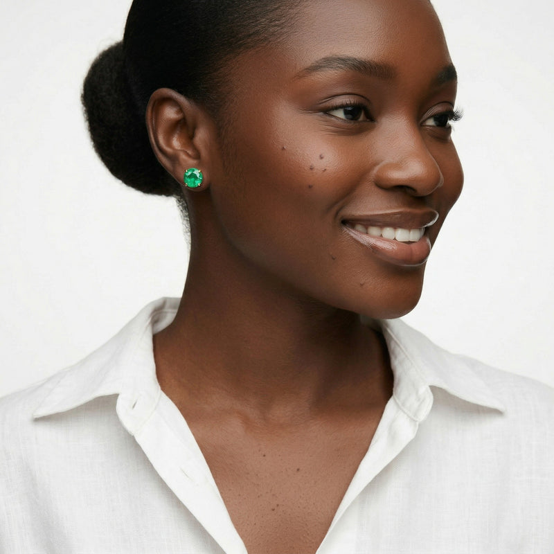 emerald birthstone stud earrings in yellow gold finish — model view