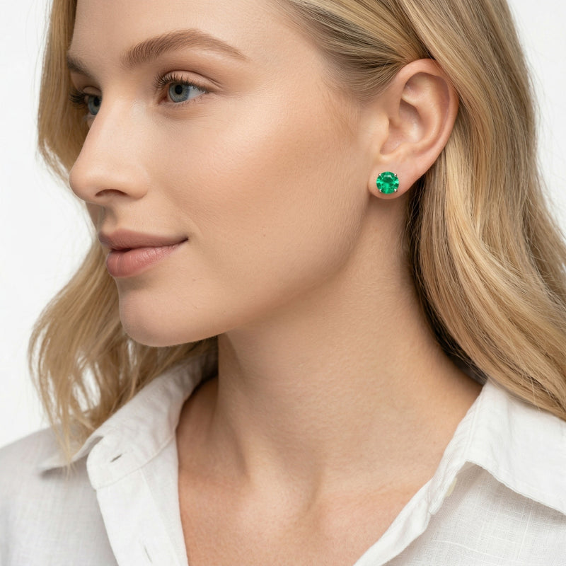 emerald birthstone stud earrings in white gold finish — model view