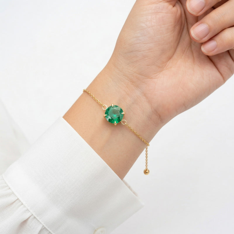 emerald birthstone bracelet in yellow gold finish — model view