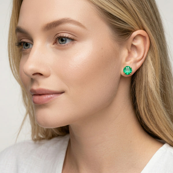 emerald birthstone stud earrings in yellow gold finish — model view