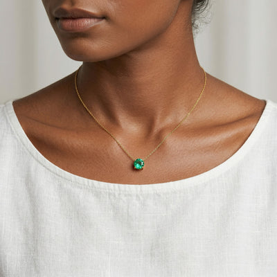 emerald birthstone necklace in yellow gold finish — model view