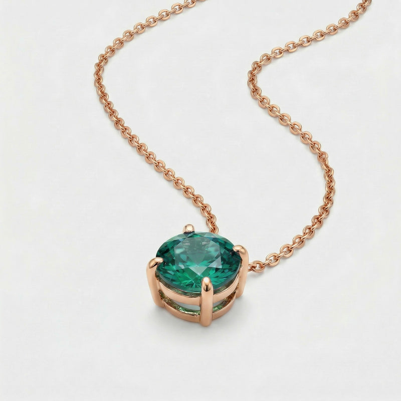 emerald birthstone necklace in rose gold finish — side view