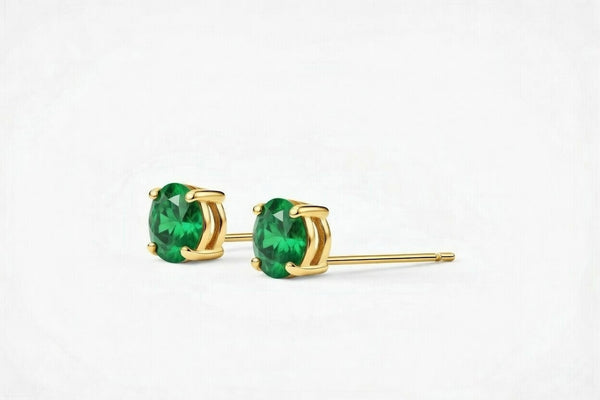 emerald birthstone stud earrings in yellow gold finish — side view