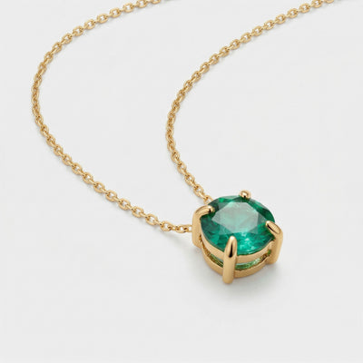 emerald birthstone necklace in yellow gold finish — side view