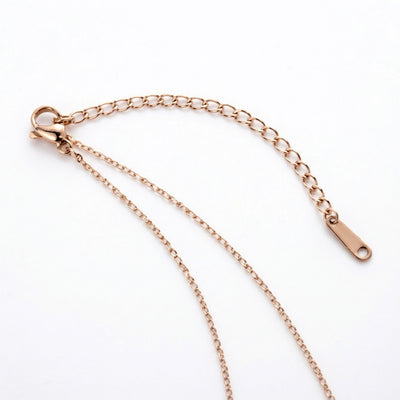 ruby birthstone necklace in rose gold finish — back view