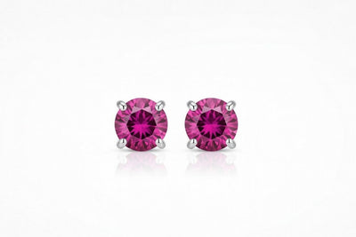 ruby birthstone stud earrings in white gold finish — front view