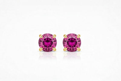 ruby birthstone stud earrings in yellow gold finish — front view