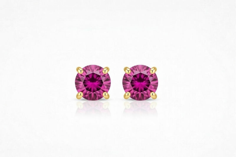 ruby birthstone stud earrings in yellow gold finish — front view