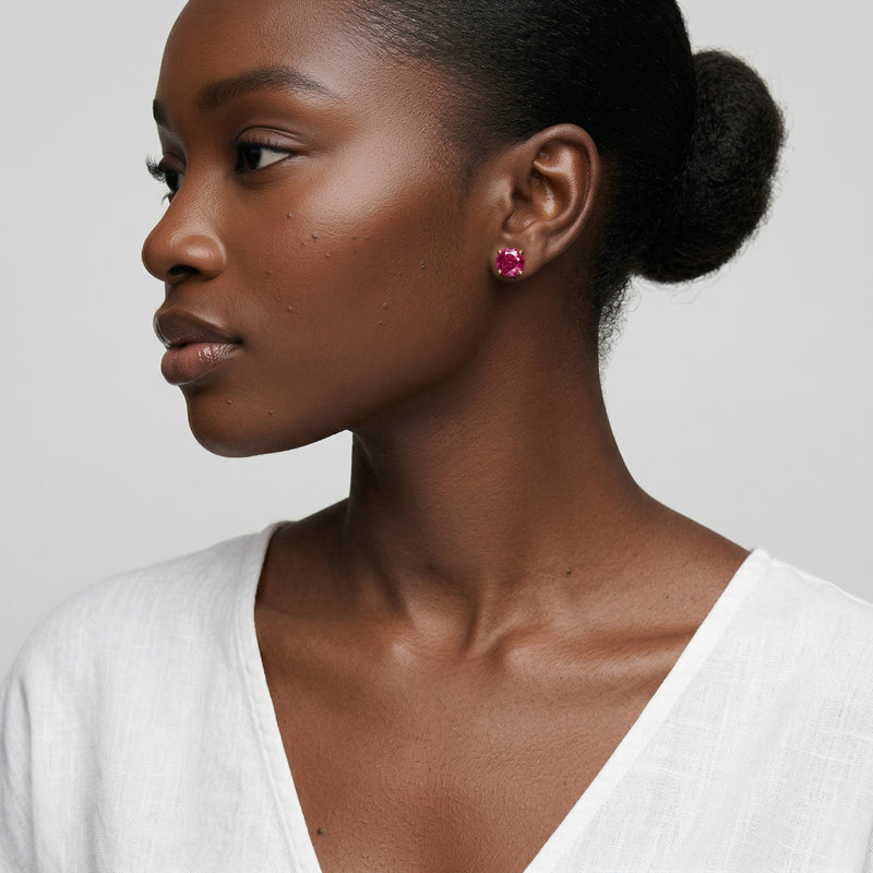 ruby birthstone stud earrings in rose gold finish — model view