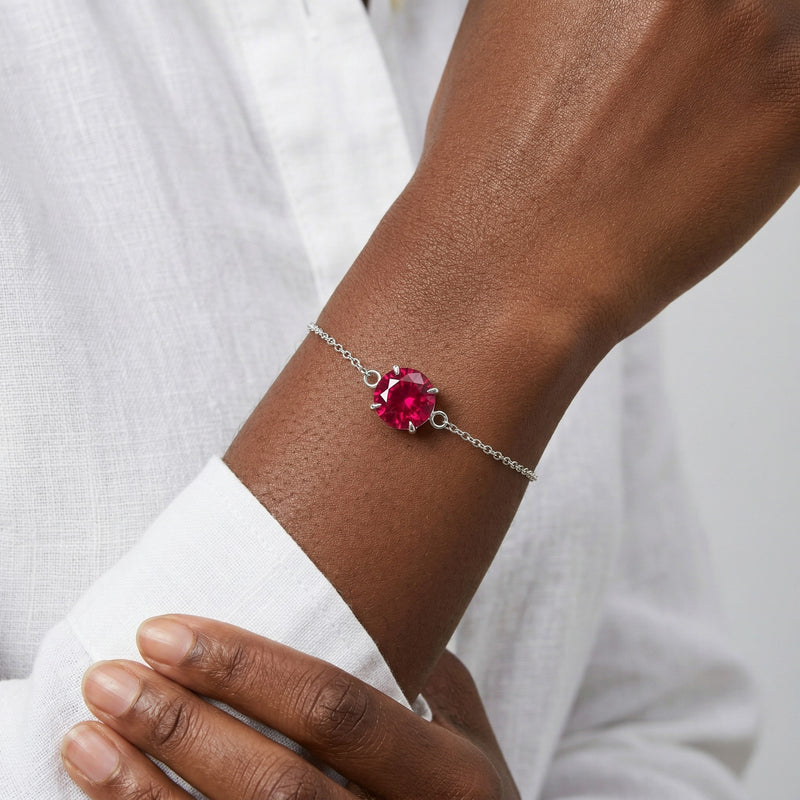ruby birthstone bracelet in white gold finish — model view