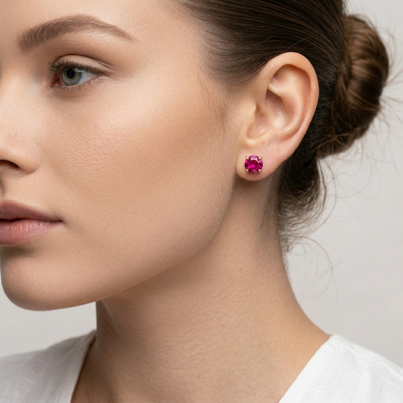 ruby birthstone stud earrings in rose gold finish — model view