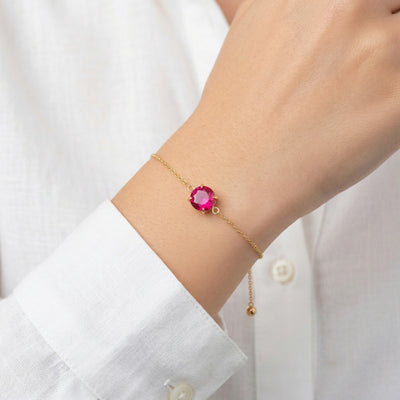 ruby birthstone bracelet in yellow gold finish — model view