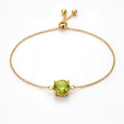 peridot birthstone bracelet in yellow gold finish — front view