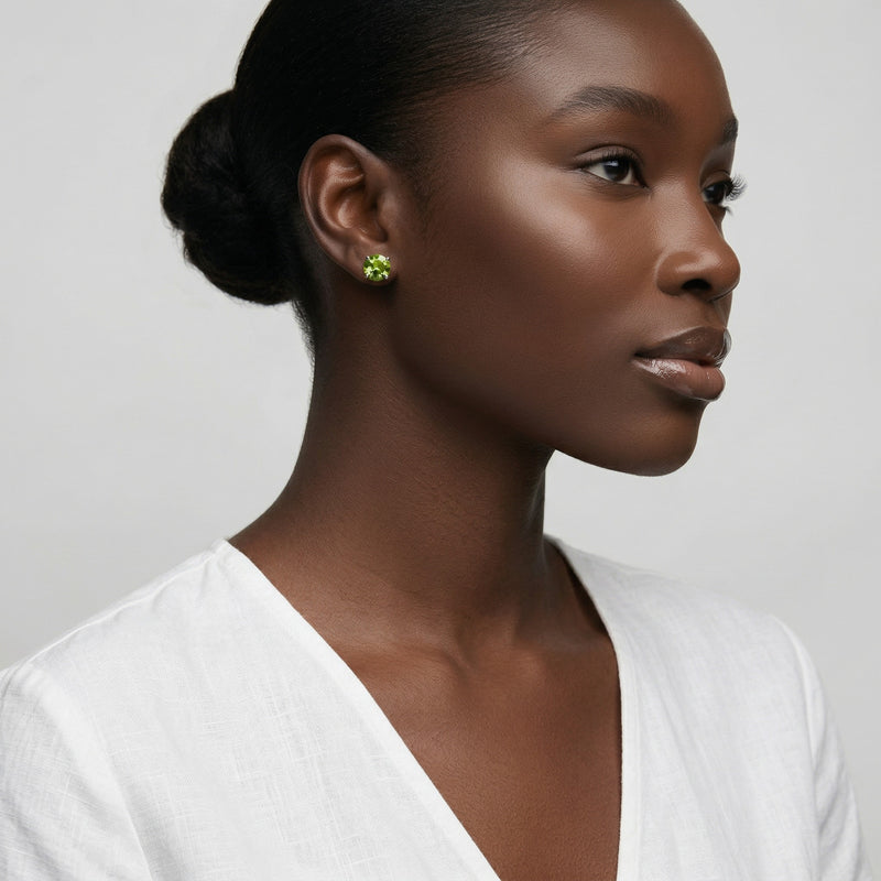 peridot birthstone stud earrings in white gold finish — model view