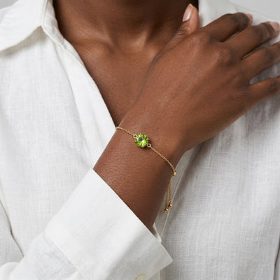 peridot birthstone bracelet in yellow gold finish — model view