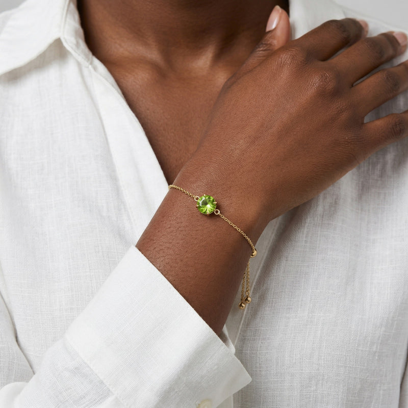peridot birthstone bracelet in yellow gold finish — model view