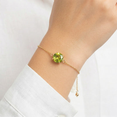 peridot birthstone bracelet in yellow gold finish — model view