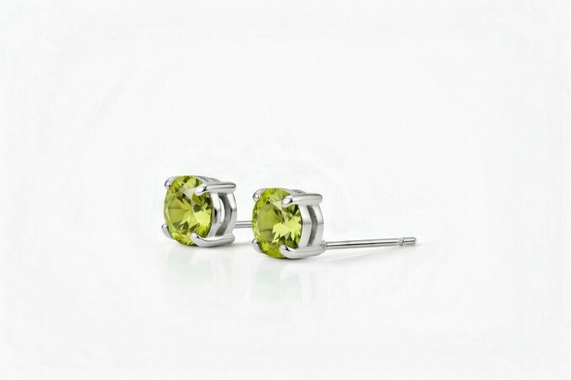 peridot birthstone stud earrings in white gold finish — side view