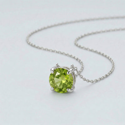 peridot birthstone necklace in white gold finish — side view