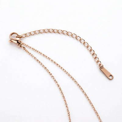 sapphire birthstone necklace in rose gold finish — back view