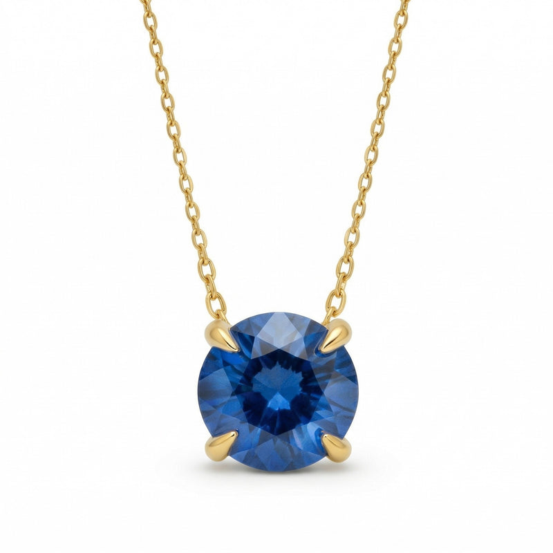 sapphire birthstone necklace in yellow gold finish — front view