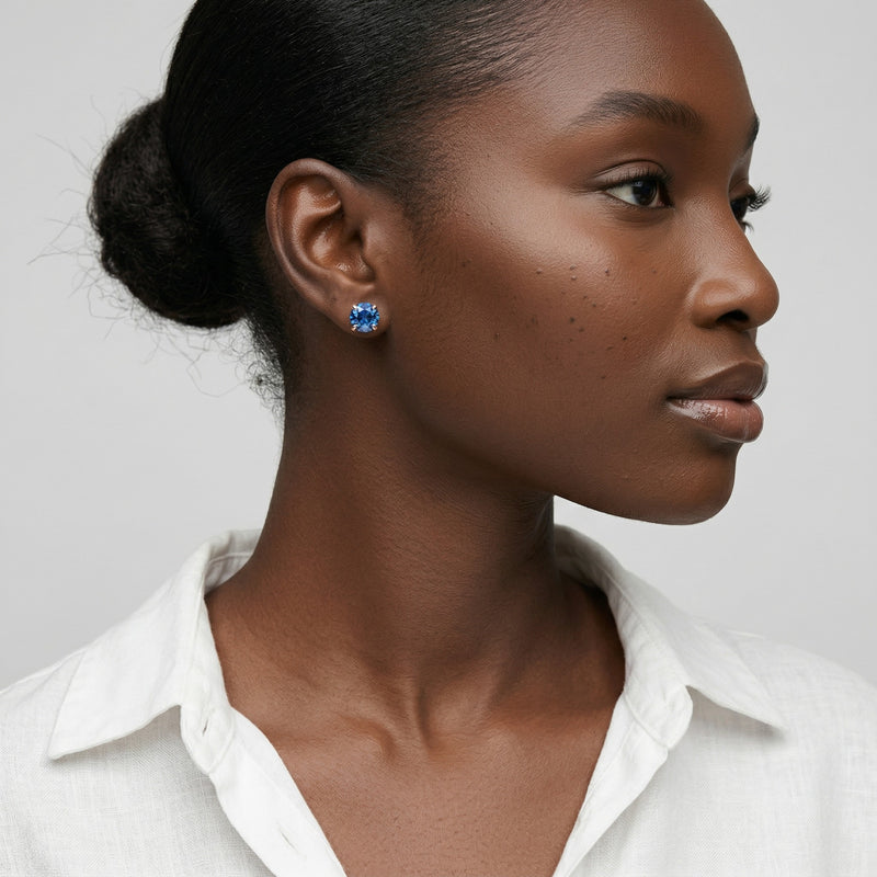 sapphire birthstone stud earrings in rose gold finish — model view