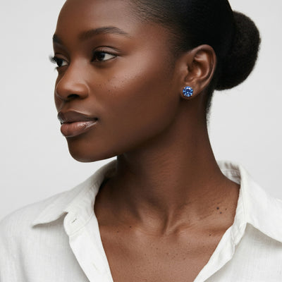 sapphire birthstone stud earrings in yellow gold finish — model view