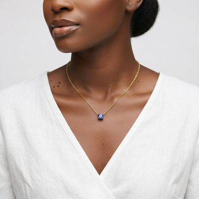 sapphire birthstone necklace in yellow gold finish — model view